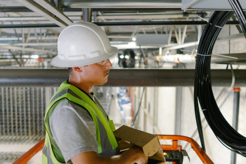 licensed electrician from Grounded Solutions carefully installing an outdoor junction box. - waterproof external junction box