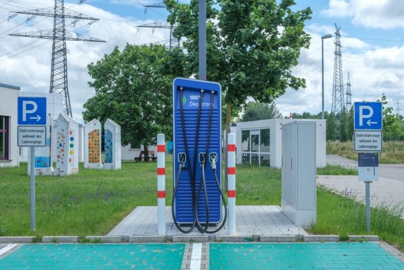 Commercial EV charging plaza with multiple electric vehicles plugged in - Commercial EV Charging
