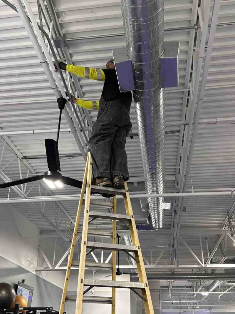 commercial ceiling fan installers in high-bay warehouse